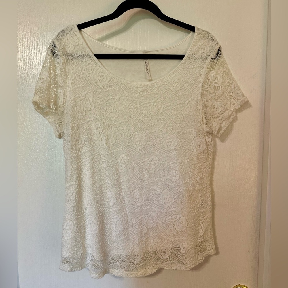 Fully lined white lace t shirt. Size large